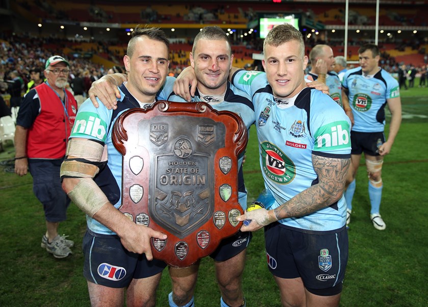 Josh Reynolds, Robbie Farah and Trent Hodkinson celebrate the series triumph in 2014.