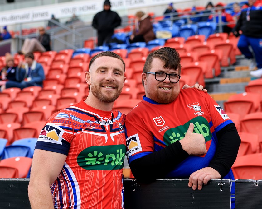 Jackson Hastings poses with a fan after Newcastle's clash with Sydney Roosters.