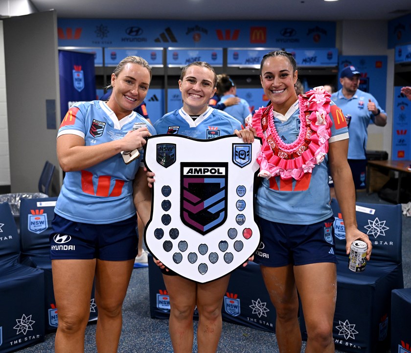 Blue Knights Olivia Higgins, Jesse Southwell and Yasmin Clydsdale celebrate NSW's State of Origin series win.